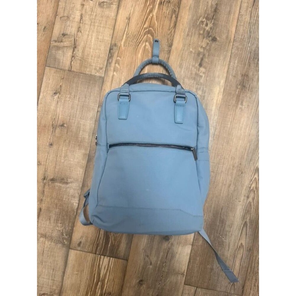 Travel backpack with luggage strap